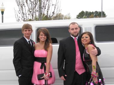 Two Couples Departing For Prom In A Hummer Limo