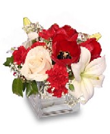Christmas Flower Arrangement with White and Red Flowers.