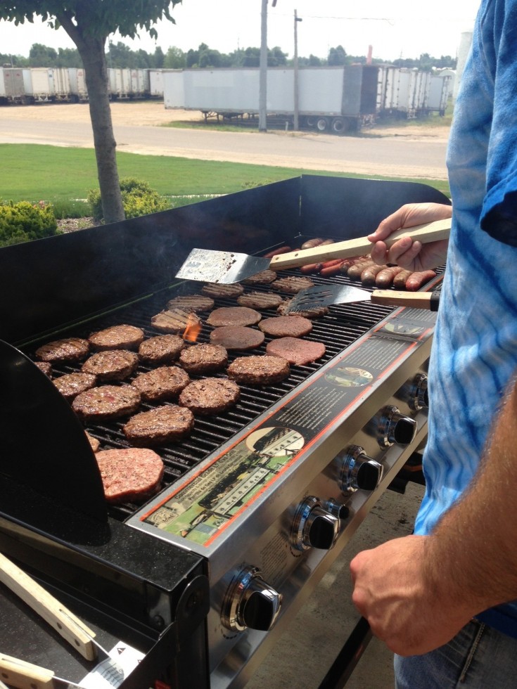 Flipping burgers out on the patio.