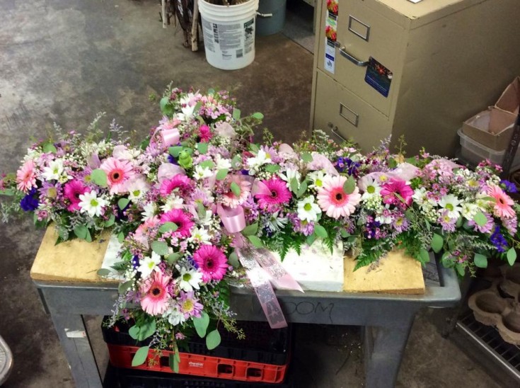 Cross shape casket spray from Brenham Floral Company in Brenham, TX