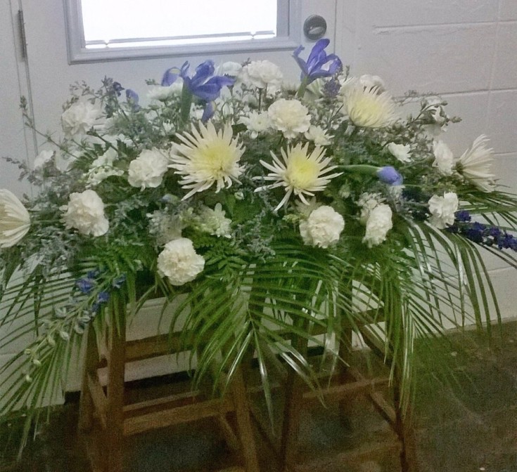 Wonderful casket spray from Wilma's Flowers in Jasper, AL