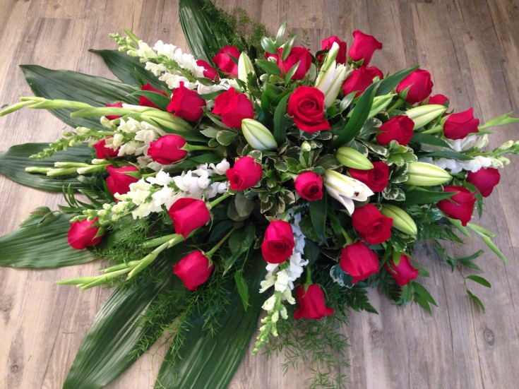 Breathtaking casket spray from Petals in Thyme of Wasaga Beach, ON