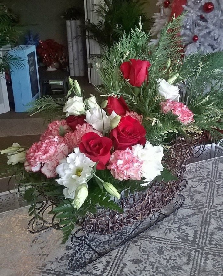 Flowers in an open sleigh from Wilma's Flowers in Jasper, AL